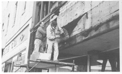 Don Martell and John Schmid working on the renovation of 21 Haywood, converted to provide street level retail and residential condominiums on upper floors.